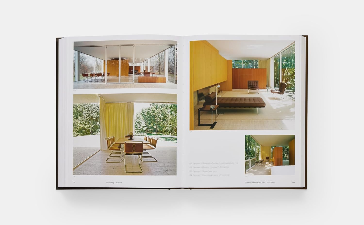 Book open to a page with interior design images on a white background